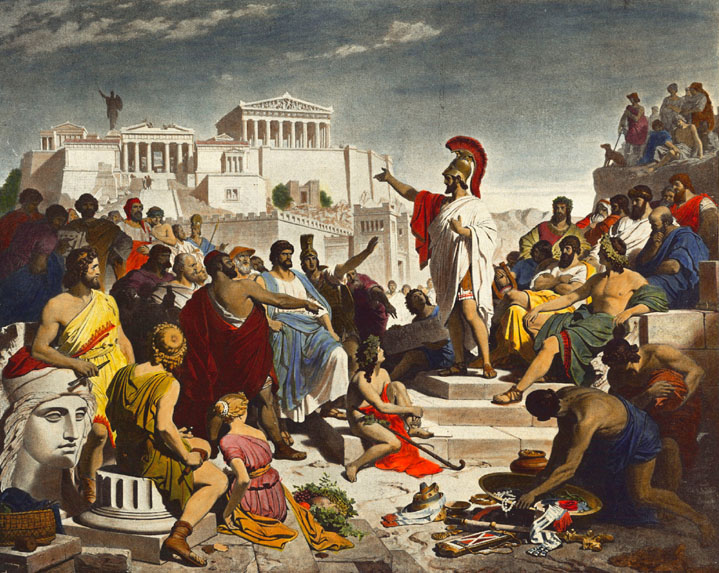 Greek civilian standing on a small podium, talking to other greek civilians
